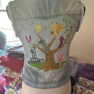 Upcycled, super unique distressed denim vest.